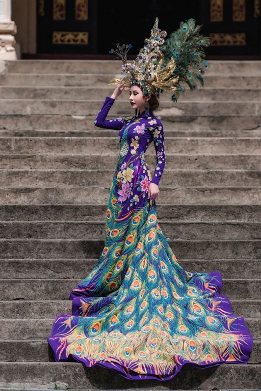 chi-nguyen-mac-ao-dai-chim-khong-tuoc-nang-20kg-tai-hoa-hau-chau-a-the-gioi-2018