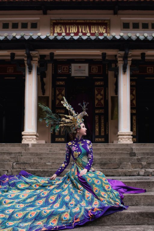 chi-nguyen-mac-ao-dai-chim-khong-tuoc-nang-20kg-tai-hoa-hau-chau-a-the-gioi-2018